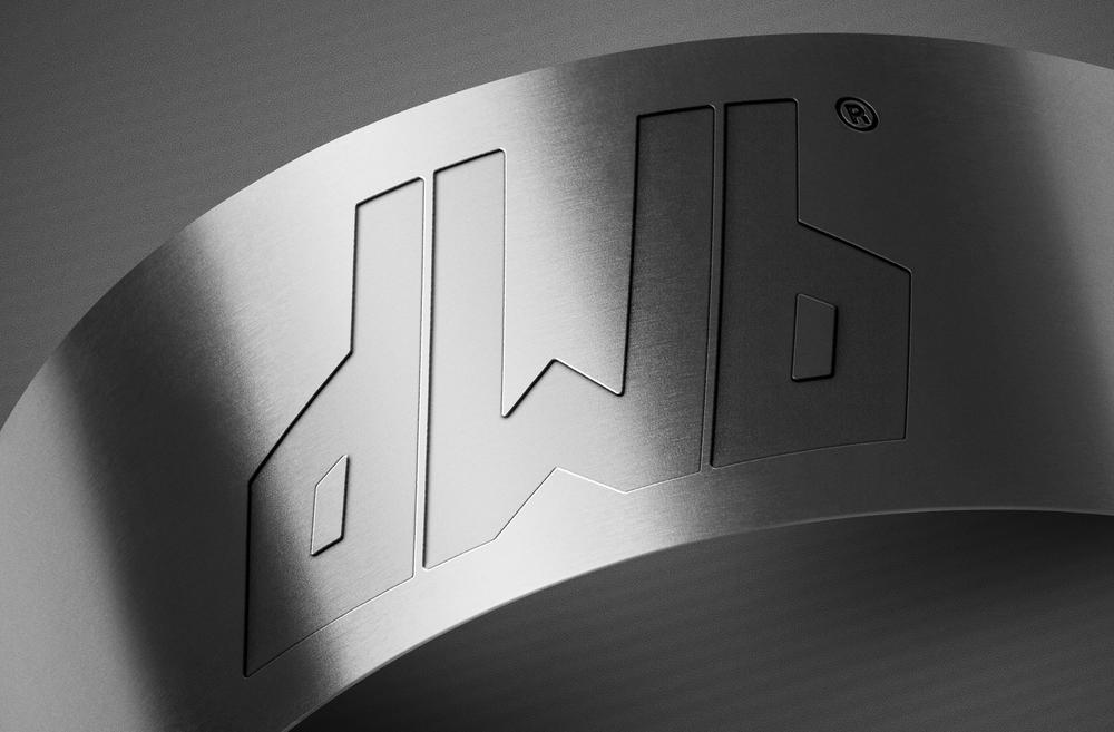 Metal engraved DWB logo mark